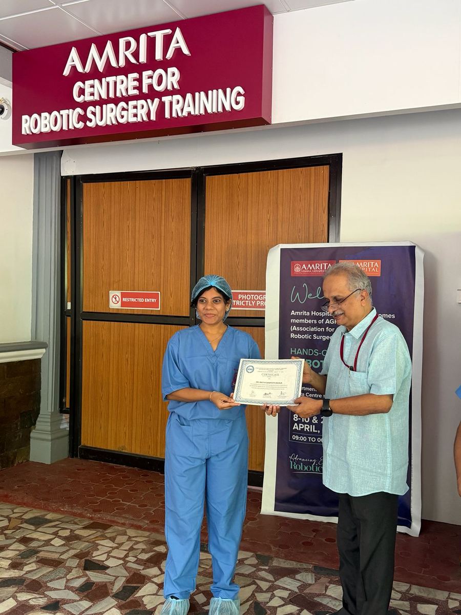 Dr. Mariam Anjum receiving certificate at Amrita Centre for Robotic Surgery Training — AGRS Wet Lab Level 2